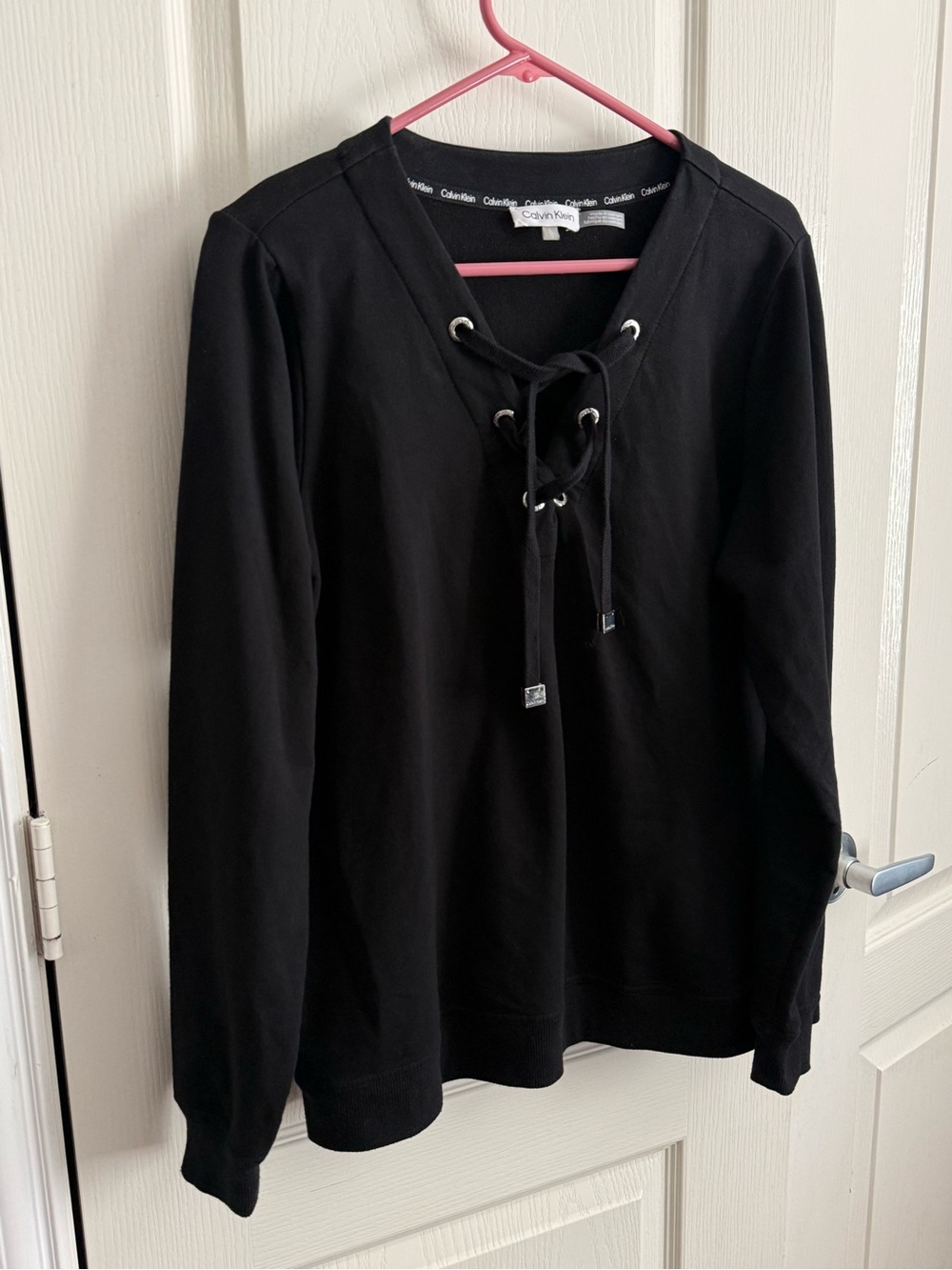 Calvin Klein lace up black pullover sweater